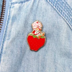 Erstwilder Sitting On A Strawberry Enamel Pin^ Enamel Pins